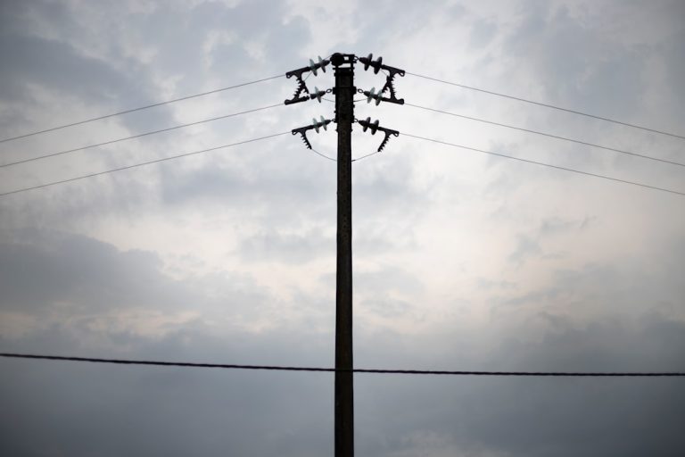 a telephone pole with power lines in the background