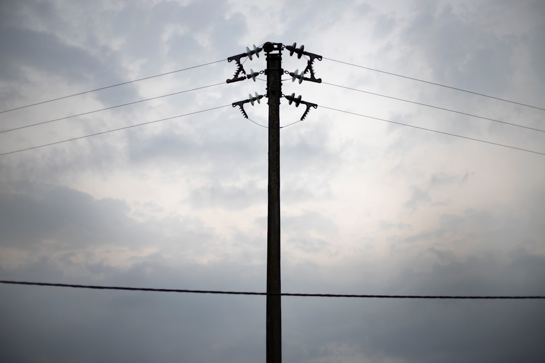 a telephone pole with power lines in the background