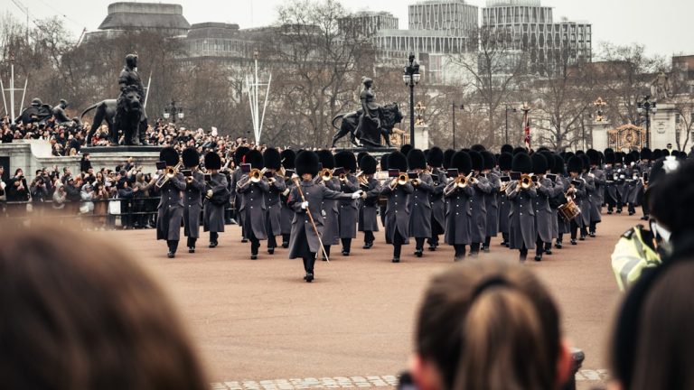 Royal guards are marching in a parade.