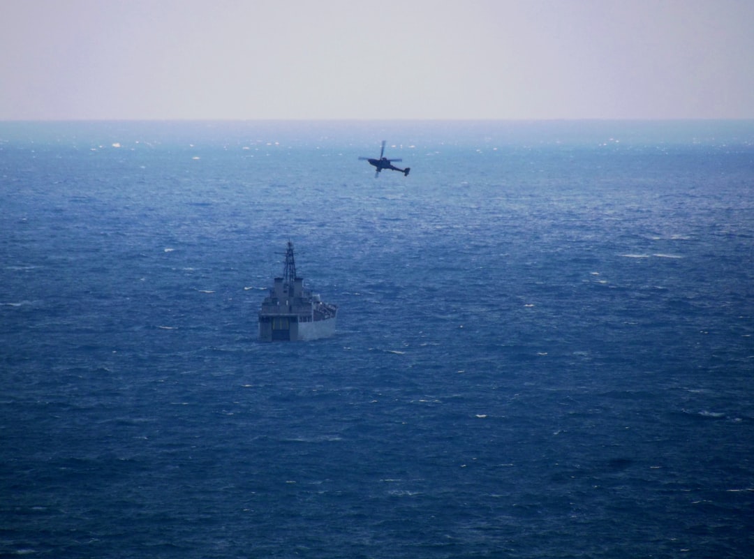 a plane flying over a large body of water