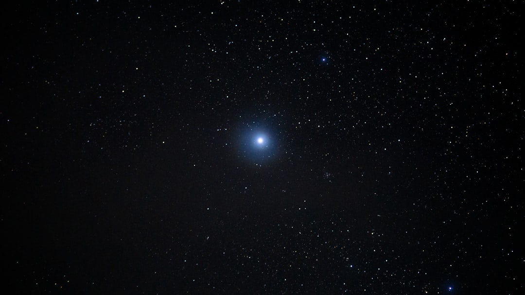 Bright star shining in the dark night sky.