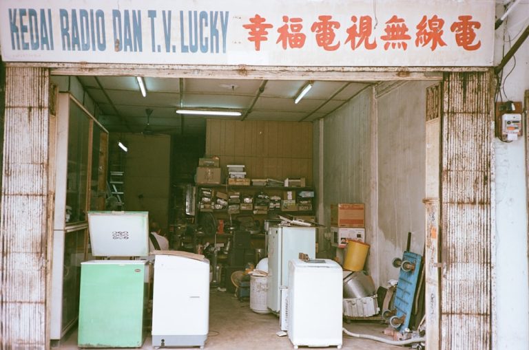 Entrance to a cluttered electronics repair shop.