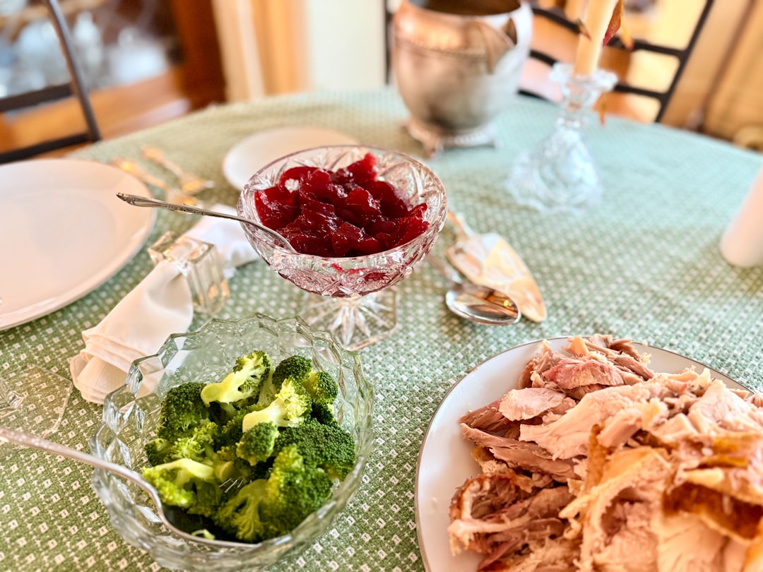 Thanksgiving dinner with turkey, cranberry sauce, and broccoli.