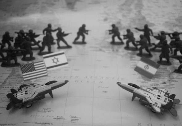 Toy soldiers and fighter jets arranged on a map.