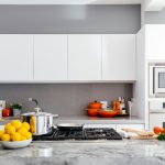 modern white kitchen with marble island